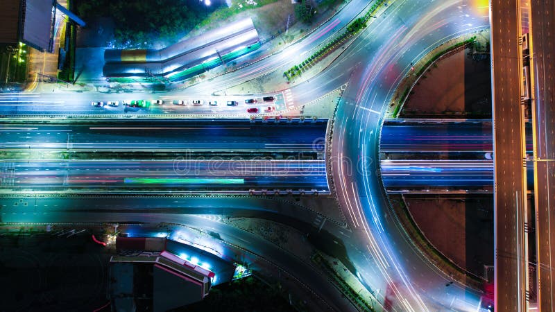 Expressway top view, Road traffic an important infrastructure, car traffic transportation above intersection road in city night