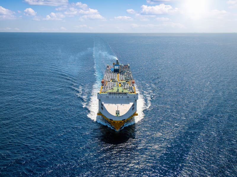 Aerial front view of iindustrial car carrier transport ship