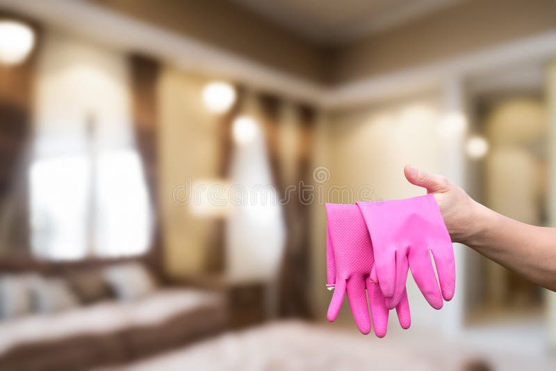 Bright pink gloves ready for cleaning tasks stock image