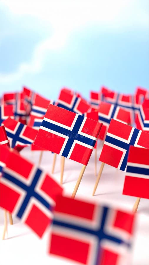 Small Norwegian flags on toothpicks against a bright sky background stock images