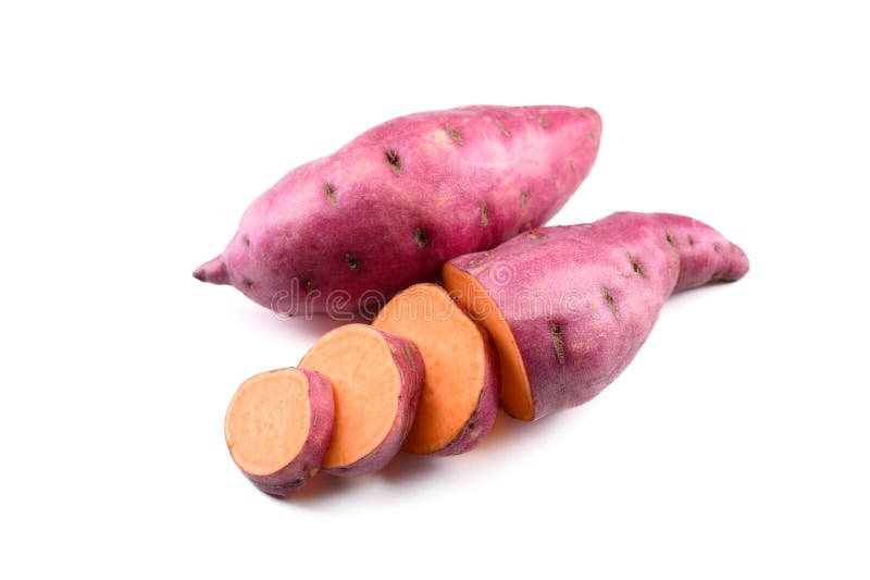 Whole and sliced pink sweet potatoes isolated on white royalty free stock photo
