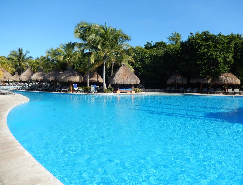 Generic tropical resort swimming pool in a Caribbean resort on the Riviera Maya, Mexico. Generic tropical resort swimming pool in a Caribbean resort on the Riviera Maya, Mexico.