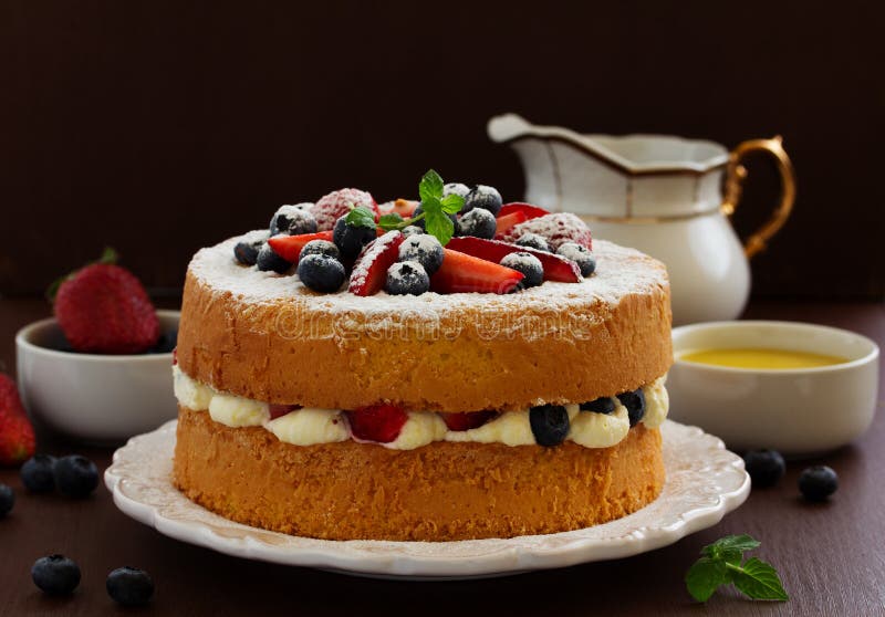 Genoise (cake) with cream, berries. And lemon cream stock photos