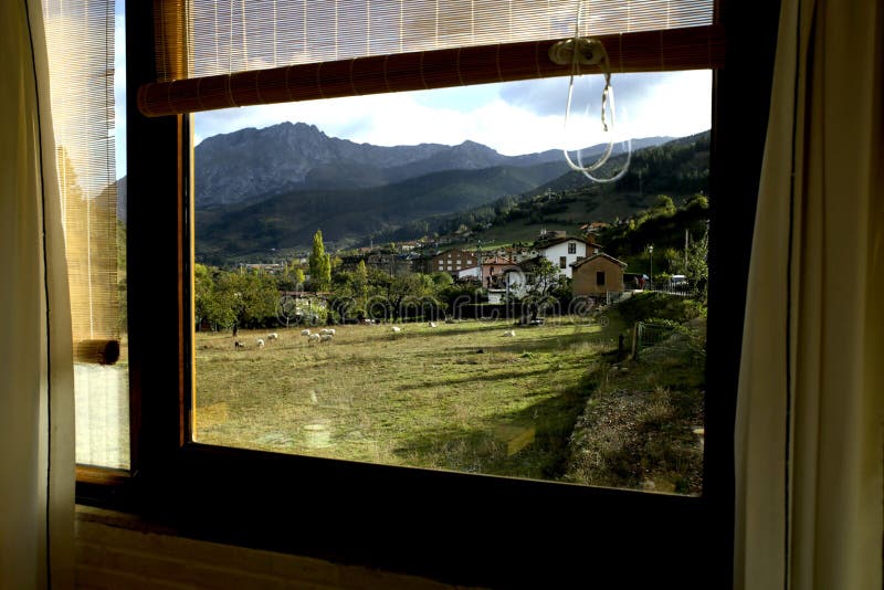 Looking through a window to a beautiful view of the rural landscape in north Spain. Looking through a window to a beautiful view of the rural landscape in north Spain