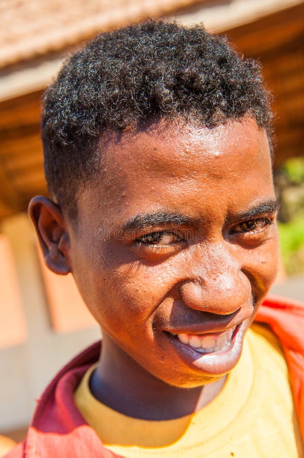 MADAGASCAR - JULY 1, 2011: Portrait of an unidentified man in Madagascar, July 1, 2011. People of Madagascar suffer of poverty due to the unstable situation. MADAGASCAR - JULY 1, 2011: Portrait of an unidentified man in Madagascar, July 1, 2011. People of Madagascar suffer of poverty due to the unstable situation.