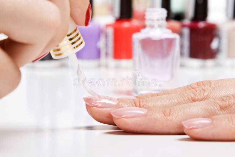 Gentle care of nails in a beauty salon royalty free stock image