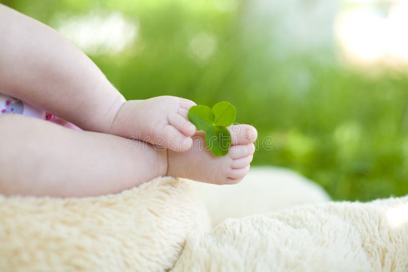 Gentle infantile legs close up