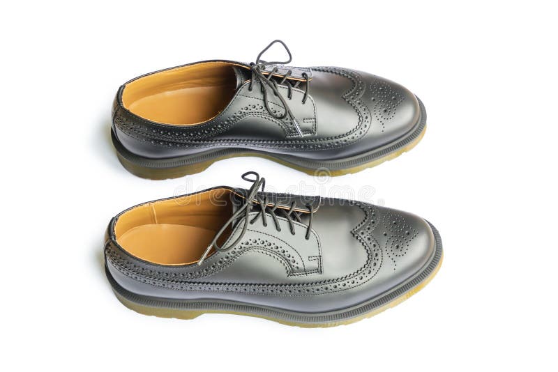 A genuine leather black brogues isolated on a white background. Smart casual style shoes