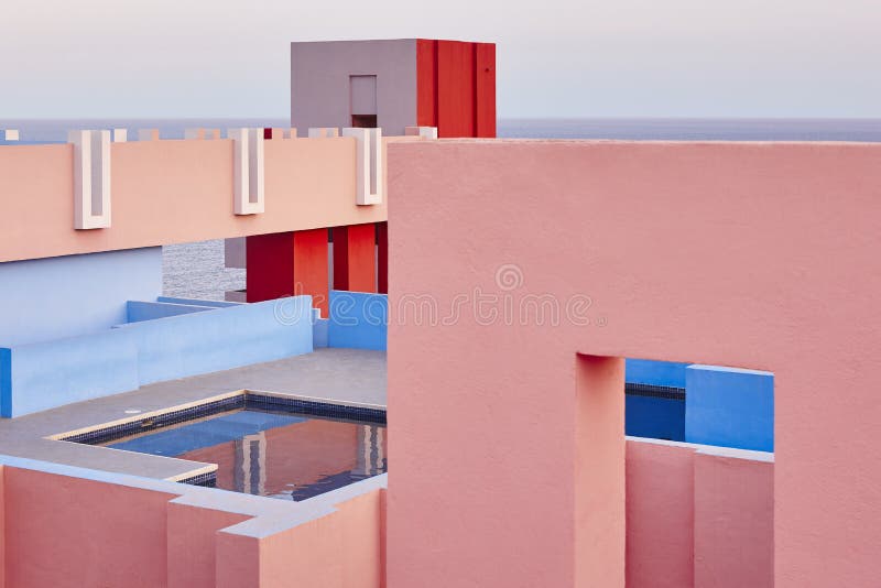 Geometric building swimming pool. Red wall, La manzanera. Calpe