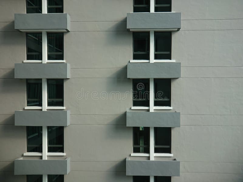 Geometric facade elevation front view of a hotel apartment balconies viewed from the next building window in Penang
