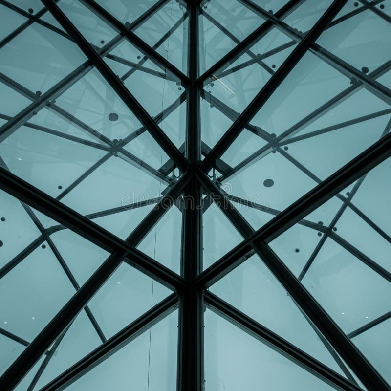 Geometric glass ceiling with a triangular, lattice structure. Made of transparent and stock illustration