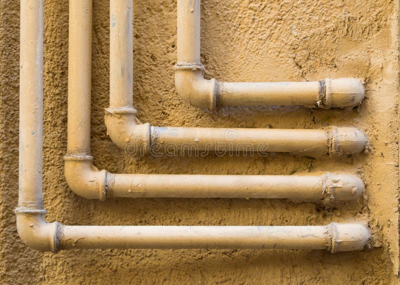 Geometric pattern of 90 degree water pipes and fittings royalty free stock image Geometric pattern of 90 degree water pipes and fittings royalty free stock image