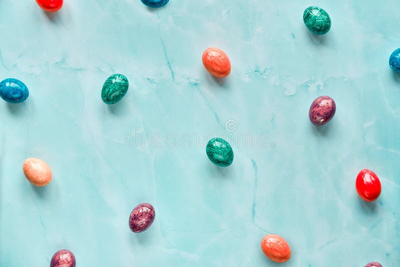 Geometric sweet minimal Easter background with marble painted Easter eggs on light stone table stock images