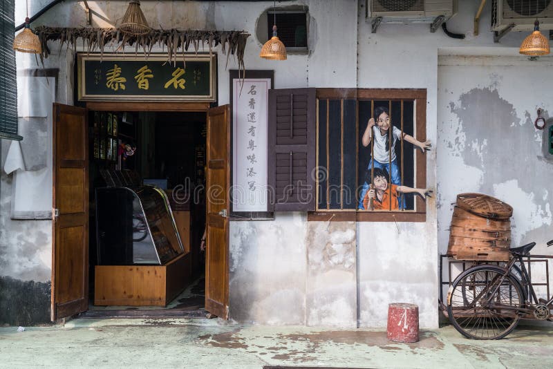Georgetown, Penang/Malaysia - circa October 2015: Street art and graffiti paintings on the walls of the building in old Georgetown royalty free stock photography Georgetown, Penang/Malaysia - circa October 2015: Street art and graffiti paintings on the walls of the building in old Georgetown royalty free stock photography