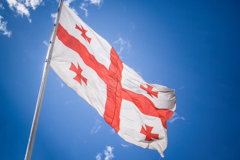 Georgia flagga under himlen royaltyfri fotografi Georgia flagga under himlen royaltyfri fotografi