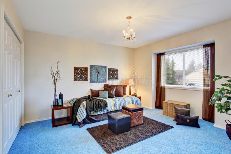 Georgous Living Room with Bright Blue Carpet. Stock Image - Image of