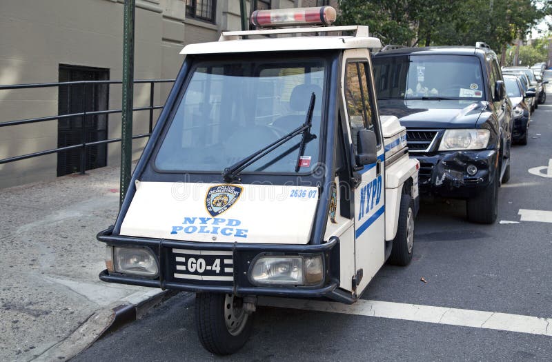 BRONX, NEW YORK - AUGUST 21: NYPD GO-4 interceptor scooter parked in community neighborhood. Taken August 21, 2015 in New York. BRONX, NEW YORK - AUGUST 21: NYPD GO-4 interceptor scooter parked in community neighborhood. Taken August 21, 2015 in New York.