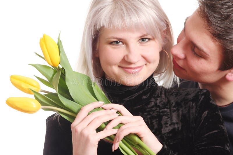 The guy gives to the beloved a bouquet of yellow colours. The guy gives to the beloved a bouquet of yellow colours