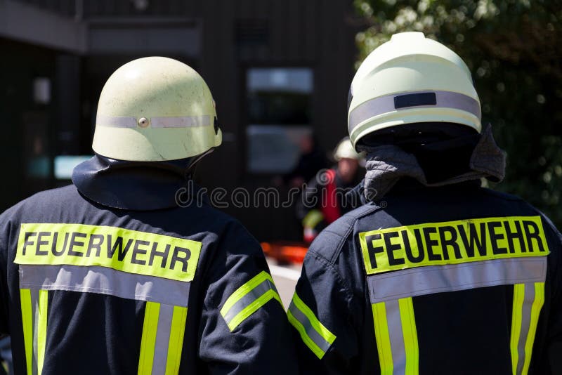 German fireman Feuerwehr stands near an accident stock photo German fireman Feuerwehr stands near an accident stock photo