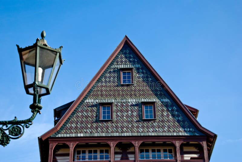 Traditional decorative German house showing pointed roof with lantern in foreground, Neustadt an der Weinstrasse, Rhineland, Germany. Traditional decorative German house showing pointed roof with lantern in foreground, Neustadt an der Weinstrasse, Rhineland, Germany.