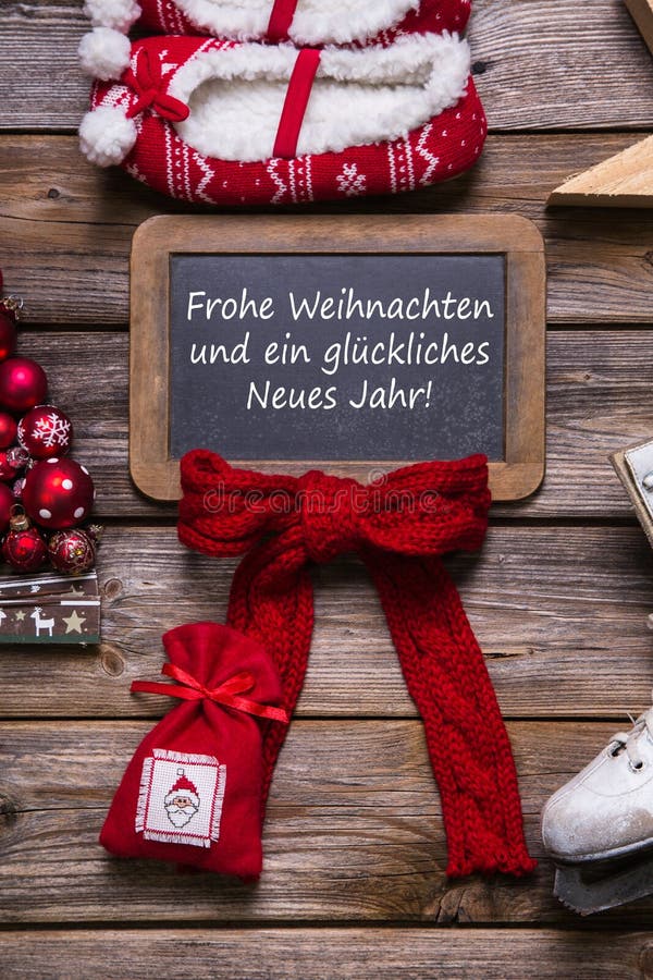 German merry christmas card with german text - decorated in red, wood and white - country style.