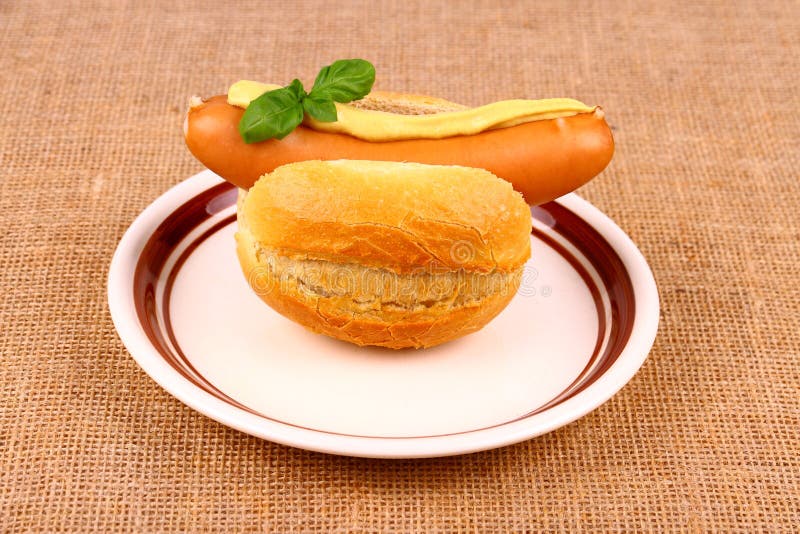 German Sausage with Bun, Mustard and Basil Stock Photo Image of jute