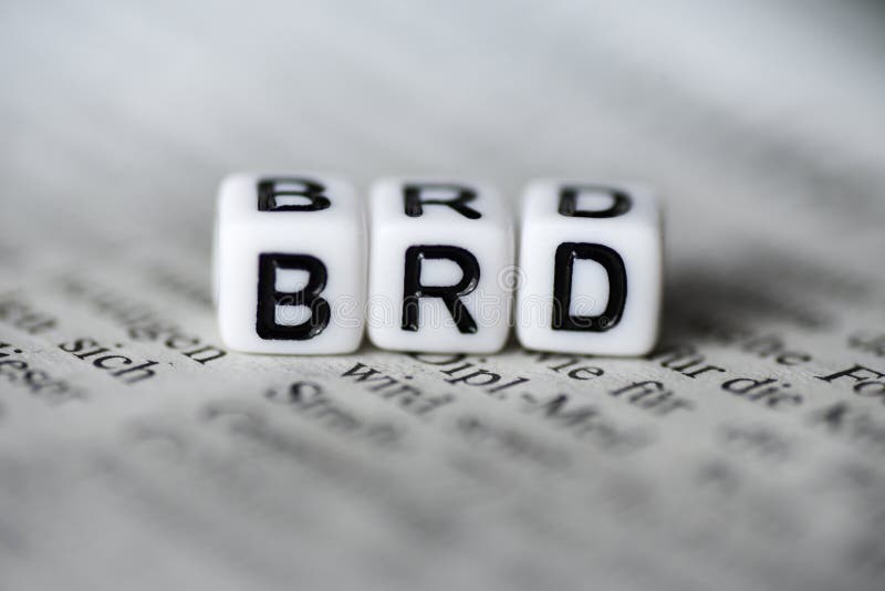 German Word BRD formed by wood alphabet blocks on newspaper