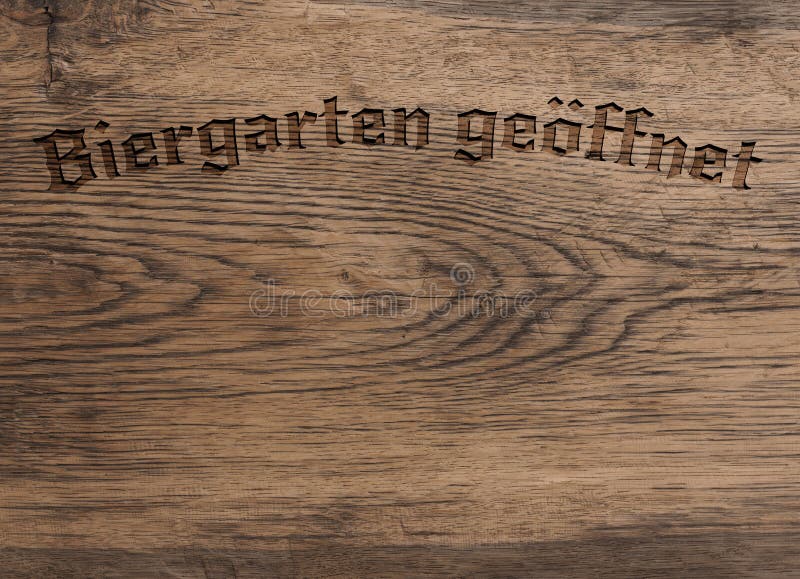 German words beer garden open on wood