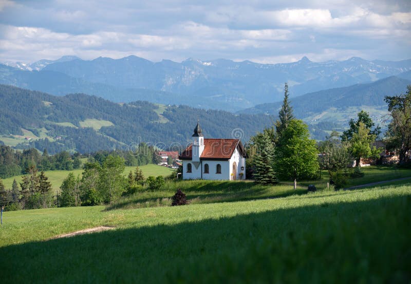 Germany, Scheidegg - June 7, 2019: Bavarian church St. Hubertus Kapelle in a sunny day. A church in a mountain