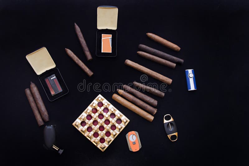 Group of rolled tobacco cigars with ash tray. Group of rolled tobacco cigars with ash tray