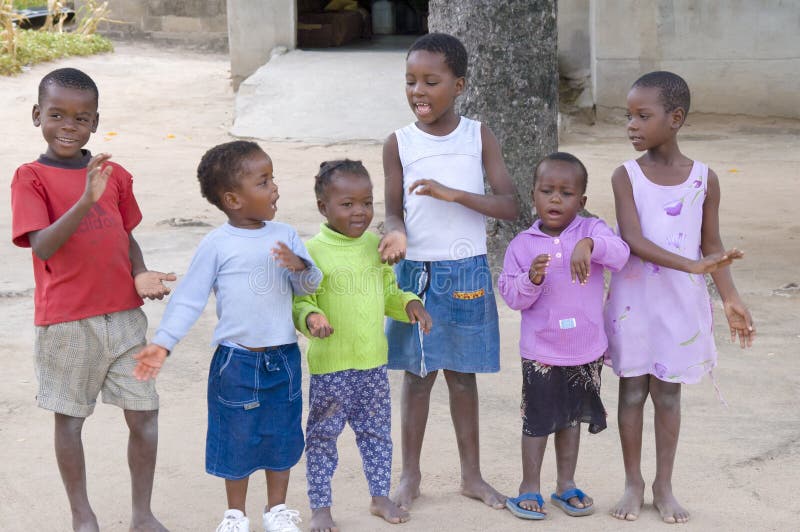 Children singing and dancing to collect money from tourists in South Africa. Children singing and dancing to collect money from tourists in South Africa