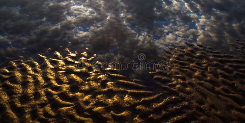 Ripped sand beaches wit clouds reflections. Ripped sand beaches wit clouds reflections