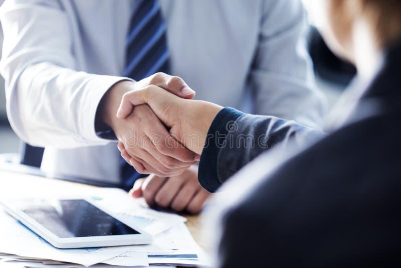 Business handshake in the office. Business handshake in the office