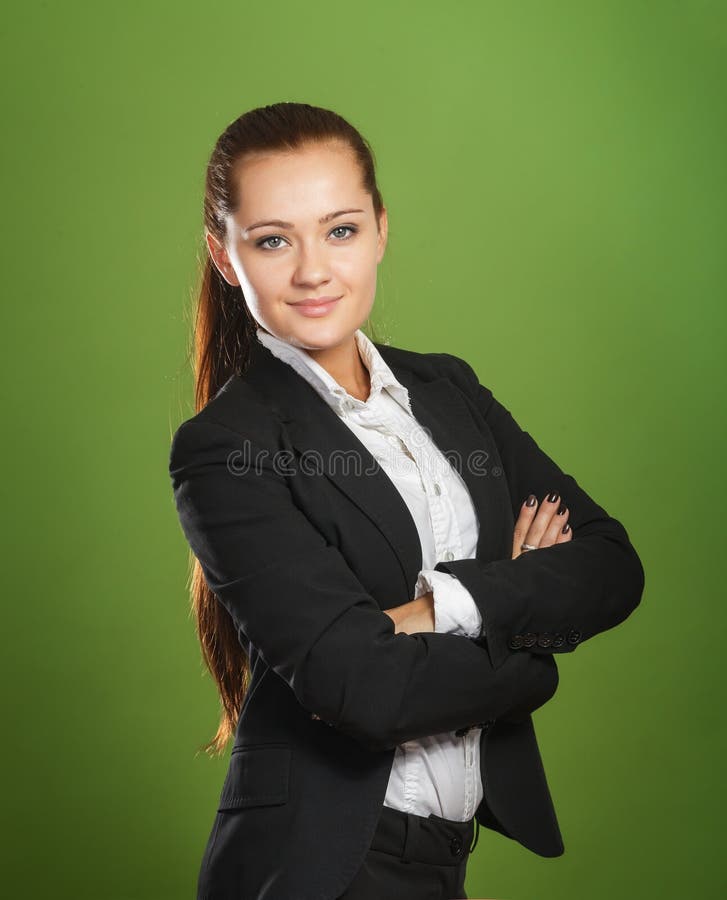 Geschäftsfrau auf grünem Hintergrund stockfotografie Geschäftsfrau auf grünem Hintergrund stockfotografie