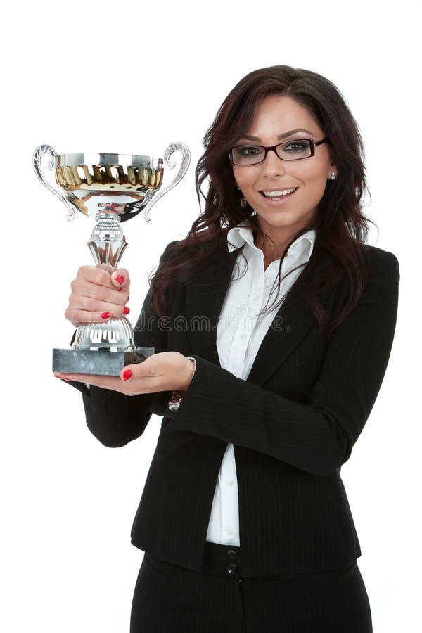 Geschäftsfrau, die eine Trophäe gewinnt lizenzfreies stockbild Geschäftsfrau, die eine Trophäe gewinnt lizenzfreies stockbild