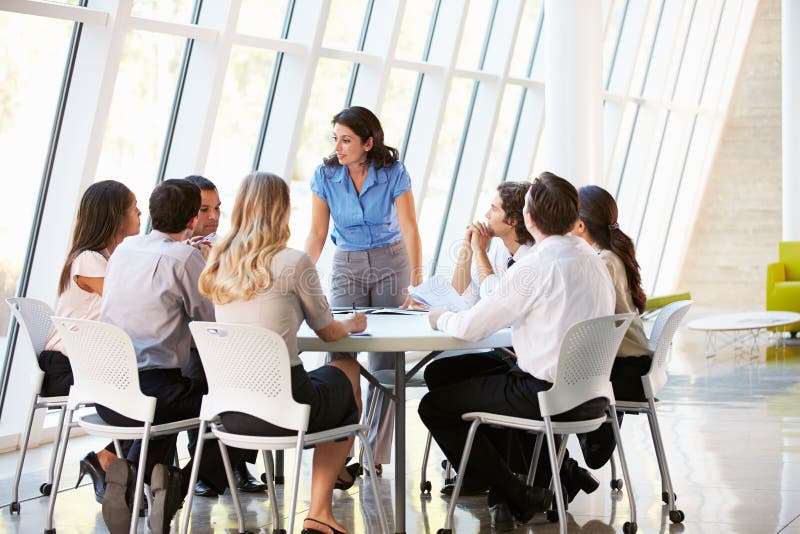 Business People Having Board Meeting In Modern Office Discussing. Business People Having Board Meeting In Modern Office Discussing