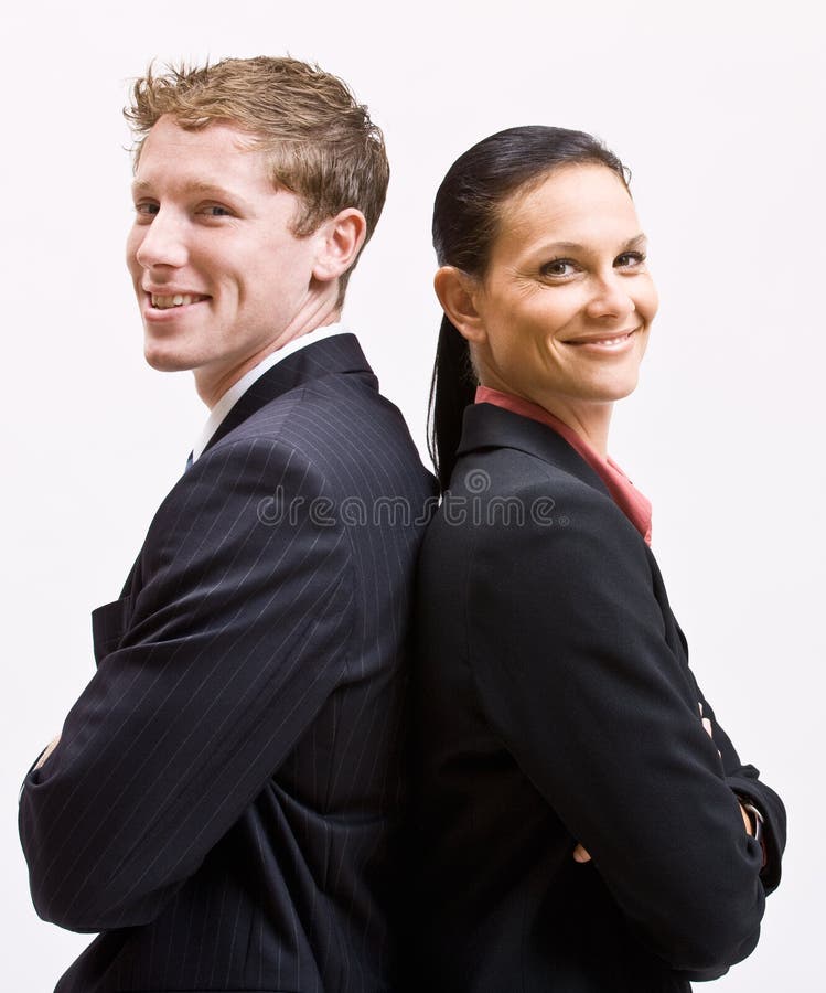 Geschäftsleute, die zurück zu Rückseite stehen lizenzfreie stockfotografie