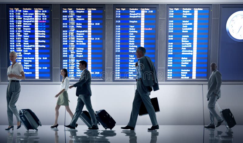 Geschäftsleute Flughafenabfertigungsgebäude-Reise-Abfahrt-Konzept- lizenzfreies stockfoto Geschäftsleute Flughafenabfertigungsgebäude-Reise-Abfahrt-Konzept- lizenzfreies stockfoto
