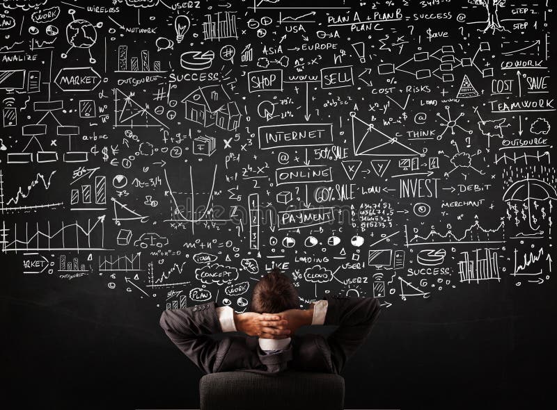 Geschäftsmann, der vor einer Tafel mit Diagrammen sitzt stockfotos Geschäftsmann, der vor einer Tafel mit Diagrammen sitzt stockfotos