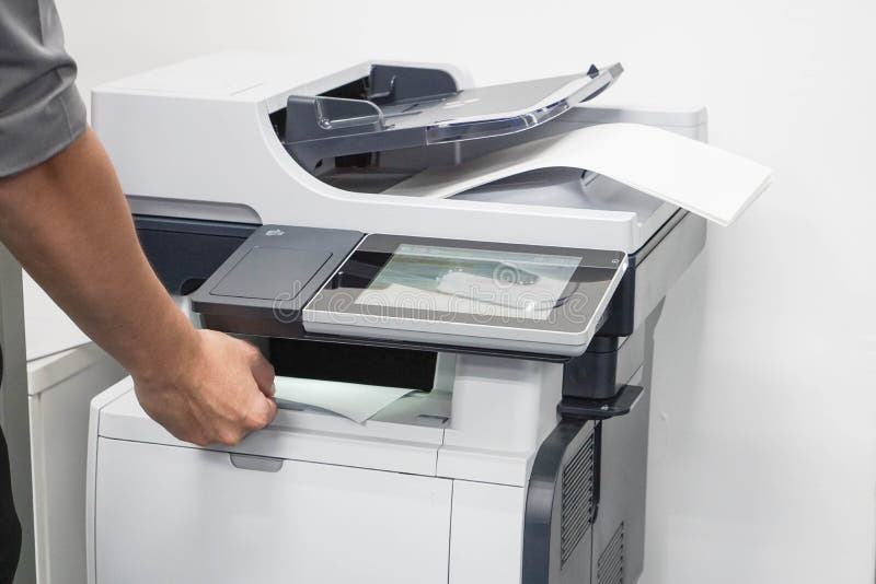 Close up businessman take a business documents from printer. Close up businessman take a business documents from printer