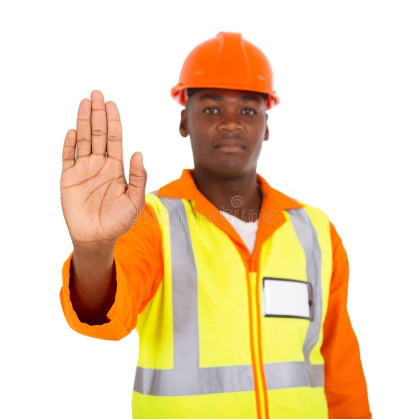 African constructor showing stop gesture on white background. African constructor showing stop gesture on white background