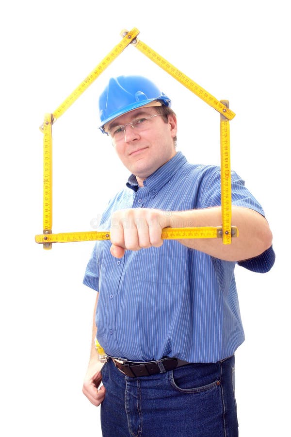 Construction site manager wearing blue helmet framing his face with yellow wooden folding rule in form of house over white. Construction site manager wearing blue helmet framing his face with yellow wooden folding rule in form of house over white