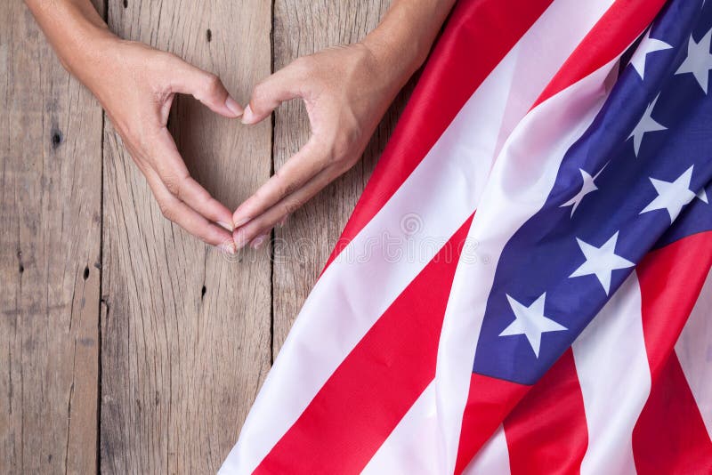 Gesture made by hands showing symbol of heart with american flag royalty free stock image Gesture made by hands showing symbol of heart with american flag royalty free stock image