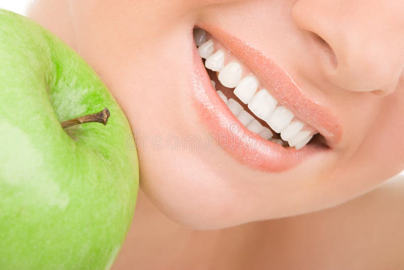 Gesunde Zähne und grüner Apfel lizenzfreie stockfotografie Gesunde Zähne und grüner Apfel lizenzfreie stockfotografie