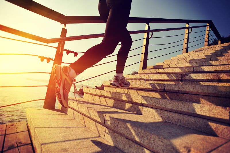 Healthy lifestyle sports woman running up on stone stairs seaside. Healthy lifestyle sports woman running up on stone stairs seaside