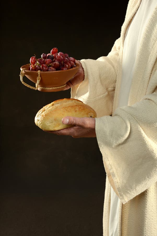Gesù che tiene l'uva e vino fotografia stock libera da diritti Gesù che tiene l'uva e vino fotografia stock libera da diritti