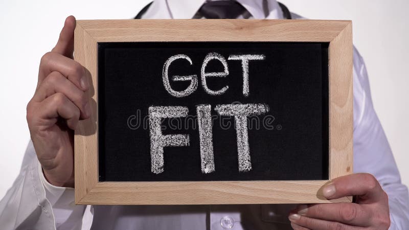 Get fit written on blackboard in doctor hands, active healthy life promotion stock photography Get fit written on blackboard in doctor hands, active healthy life promotion stock photography