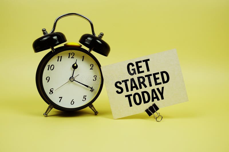 Get Started Today text message on paper card with alarm clock on yellow background royalty free stock photos