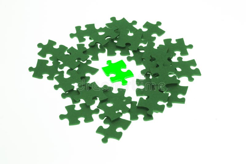 Isolated piece of luminous green jigsaw puzzle on white background. Isolated piece of luminous green jigsaw puzzle on white background