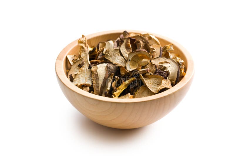 Getrocknete Pilze in der hölzernen Schüssel lizenzfreies stockbild Getrocknete Pilze in der hölzernen Schüssel lizenzfreies stockbild